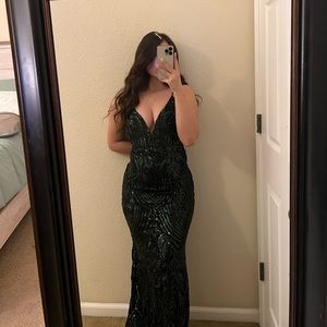 dark green mermaid sequin dress with a low cut in the front